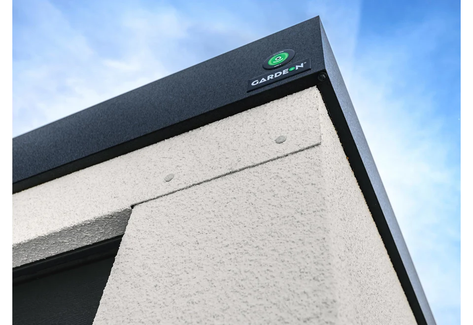 Garden house with Hormann safety garage door
