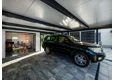 Garden house with Hormann safety garage door