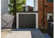 Garden house with Hormann safety garage door