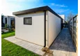 Garden house with Hormann safety garage door