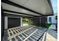 Garden house with Hormann safety garage door