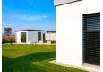 Garden house with Hormann safety garage door