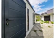Garden house with Hormann safety garage door